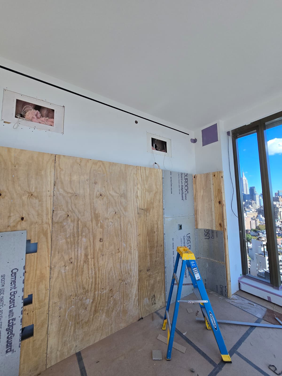 Wall prepared with plywood and cement board ready for finishes